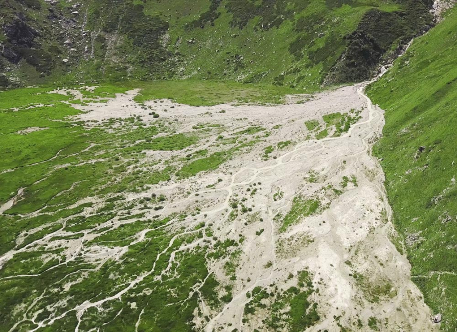 Large areas of vegetation washed away by overland erosion.