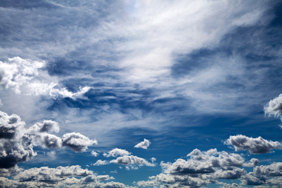 Clouds overhead in a blue sky.