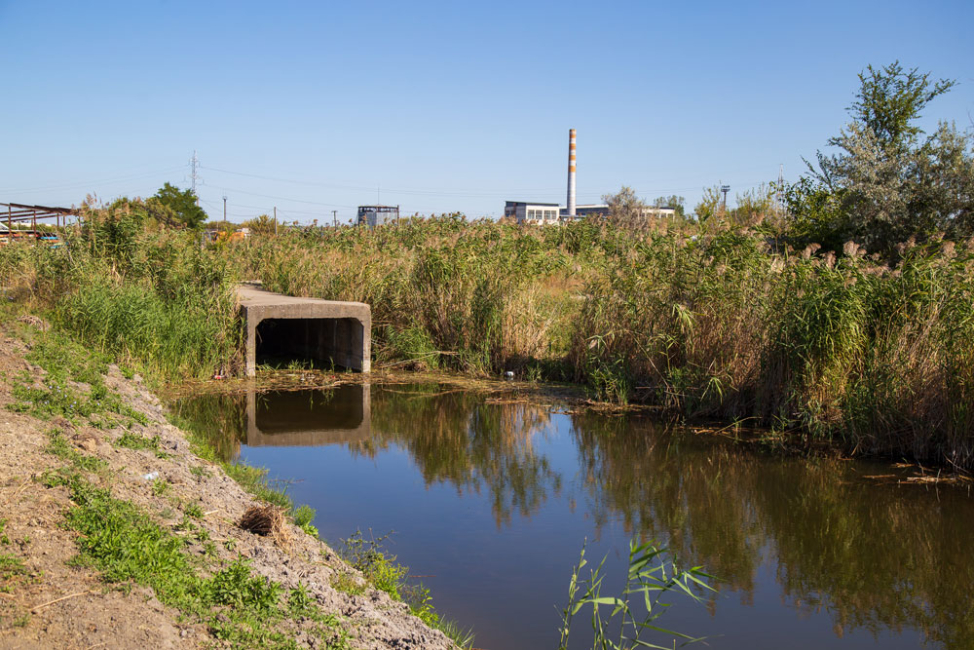 Concrete box culvert in stormwater drainage channel.