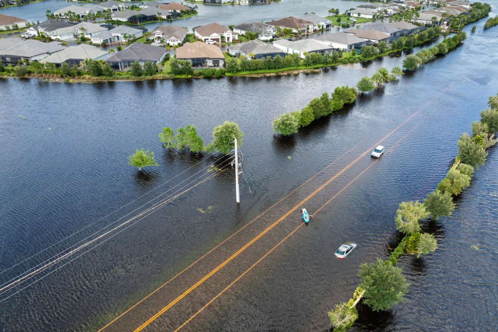 Housing development and road flooded by hurricane.