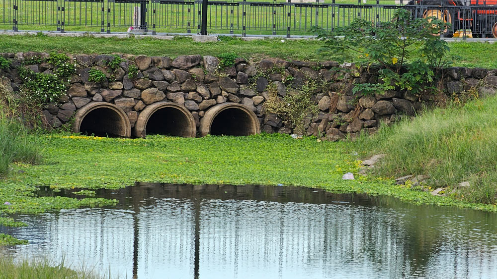 Three cross culverts under the road at large stream.