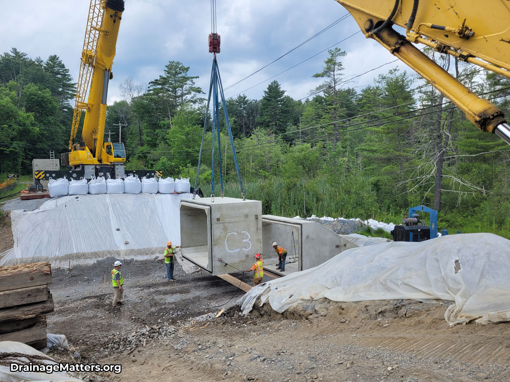 Crane placing Luzerne Road precast culvert