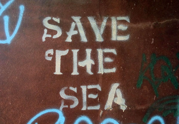 Save the Sea graffiti on wall